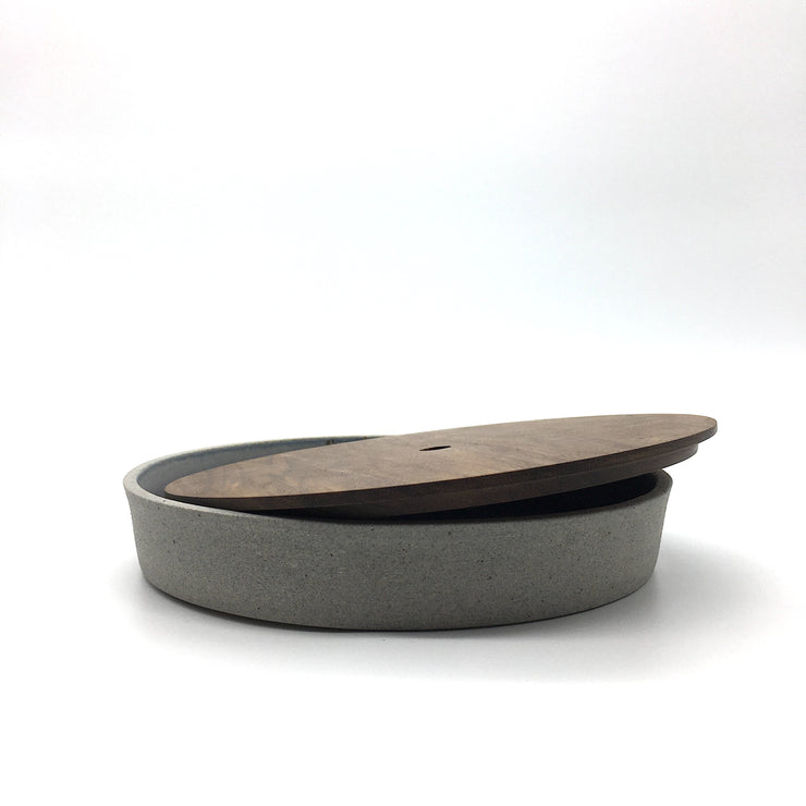 Part of the FS Collection, the FS BOX is a FS Cazuela with an hand-turned wooden lid. The hole in the center of the lid allows you to lift it easily with one finger. This versatile trinket box was originally designed to sit on desk or night stand, but it can be used anywhere in the house or office. 