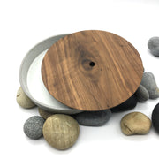 Part of the FS Collection, the FS BOX is a FS Cazuela with an hand-turned wooden lid. The hole in the center of the lid allows you to lift it easily with one finger. This versatile trinket box was originally designed to sit on desk or night stand, but it can be used anywhere in the house or office. 